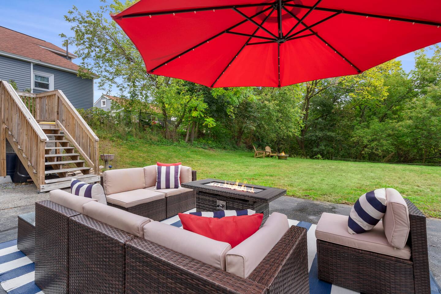 Garden seating and fire pit at a managed home